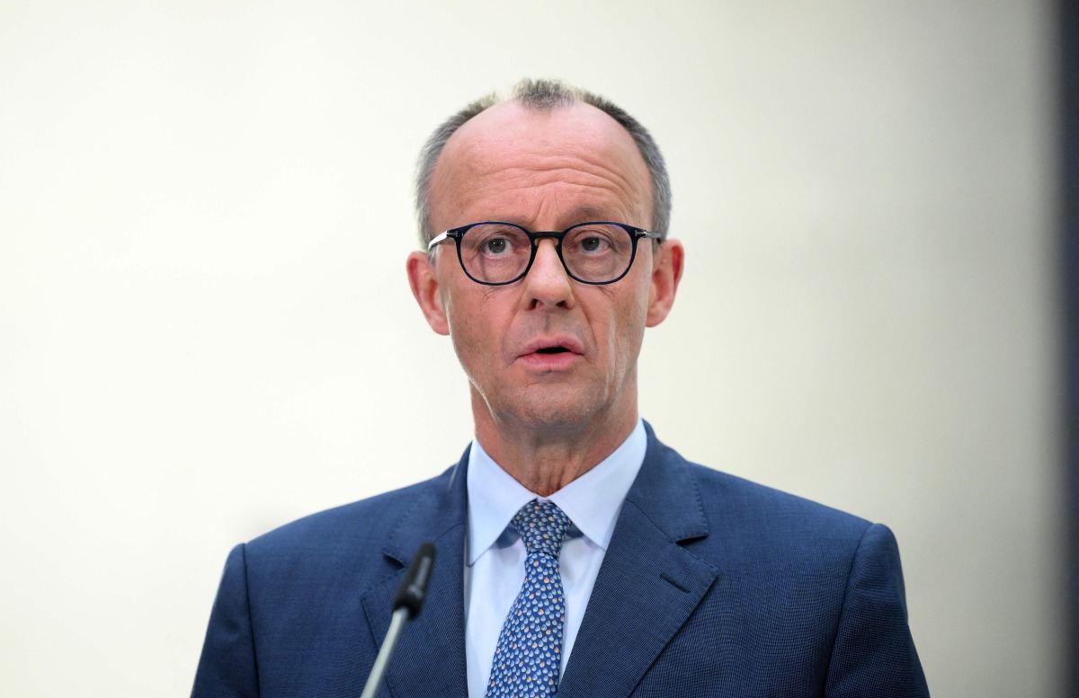 The leader of Germany's Christian Democratic Union (CDU) party Friedrich Merz gives a statement in Berlin on March 8, 2025, as exploratory talks were held between the conservative CDU/CSU union and the social democratic SPD party on forming a future government coalition following Germany's February 23 general election. (Photo by RALF HIRSCHBERGER / AFP)

