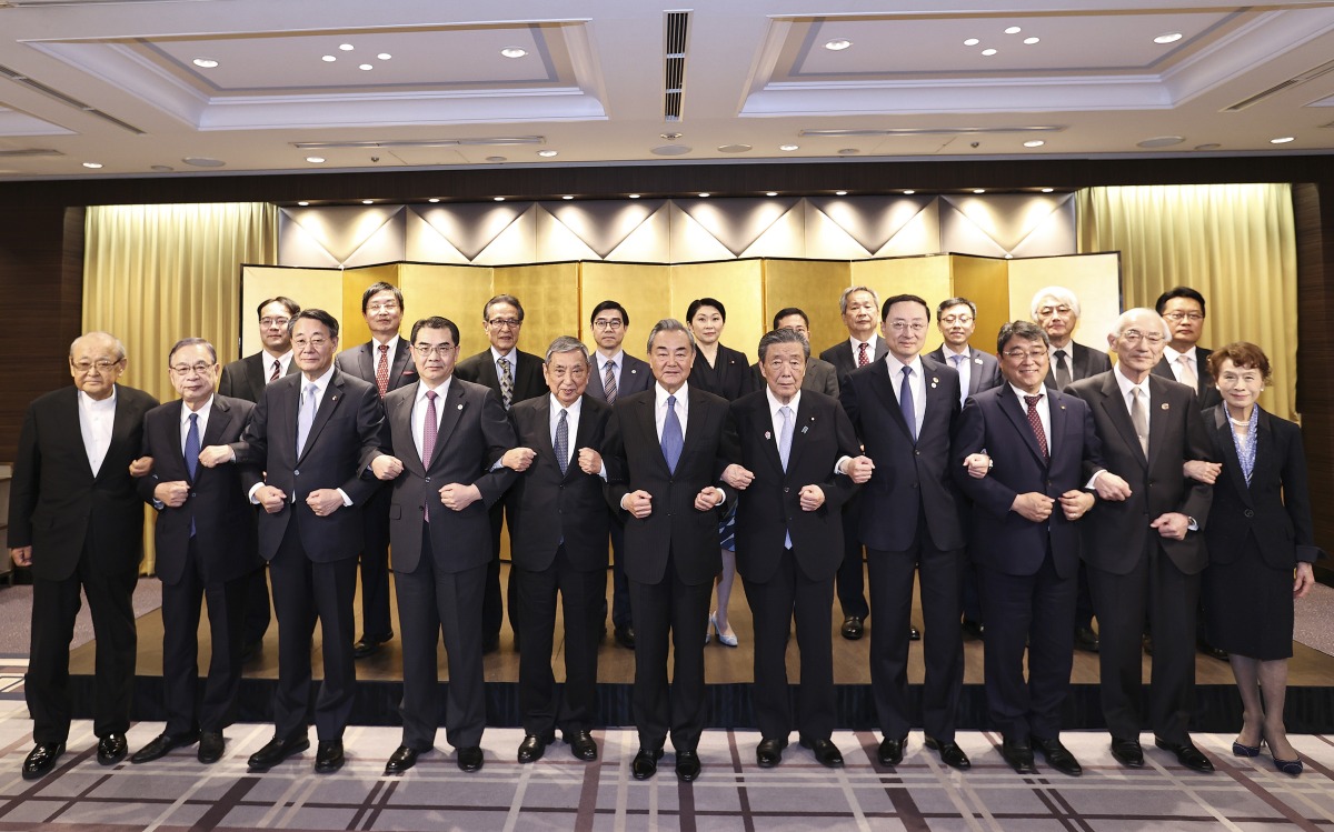 Wang Yi, a member of the Political Bureau of the Communist Party of China (CPC) Central Committee and director of the Office of the Foreign Affairs Commission of the CPC Central Committee, meets with representatives from seven Japan-China friendship groups in Tokyo, Japan, March 23, 2025. (Xinhua/Jia Haocheng)
