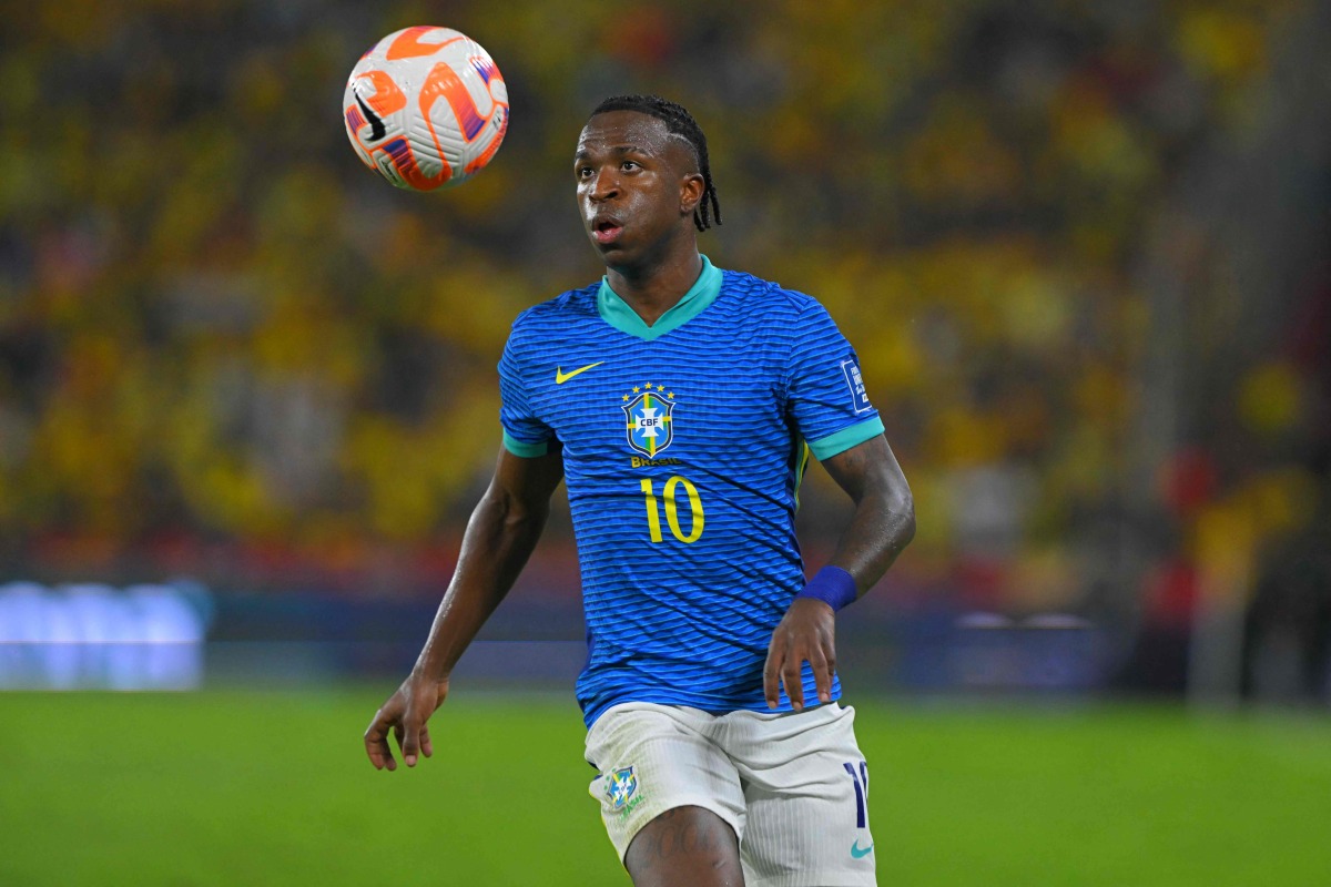 Brazil's forward #10 Vinicius Jr eyes the ball during the 2026 FIFA World Cup South American qualifiers football match between Ecuador and Brazil at the Monumental Banco Pichincha stadium in Guayaquil, province of Guayas, Ecuador on June 5, 2025. (Photo by Rodrigo BUENDIA / AFP)

