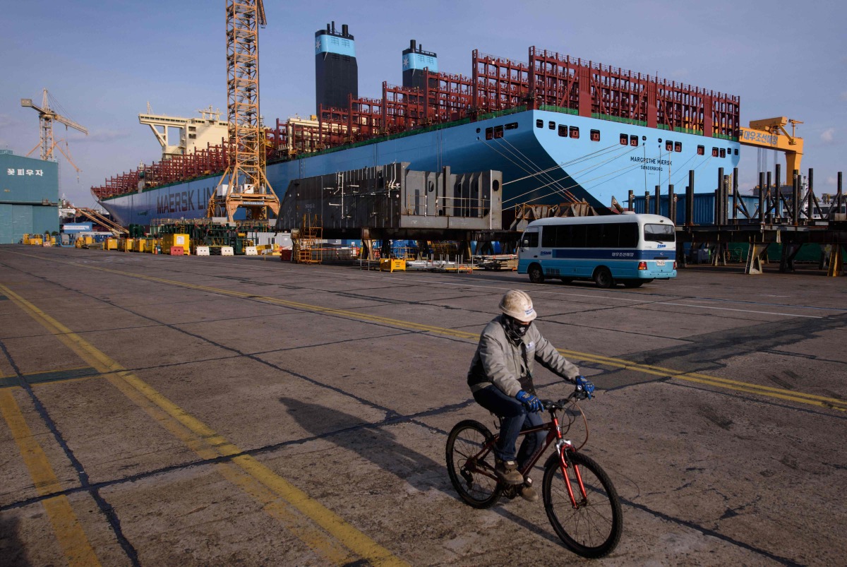 This file photo taken on December 3, 2014 shows a general view of an under-construction Maersk triple-E class container ship at the Daewoo DSME shipyard in Okpo, 60km south of Busan. Photo by ED JONES / AFP