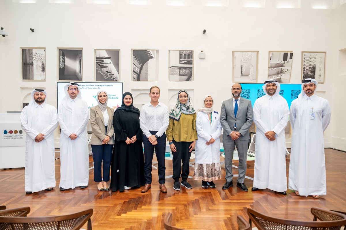 Speakers and officials in a group photo at the event.