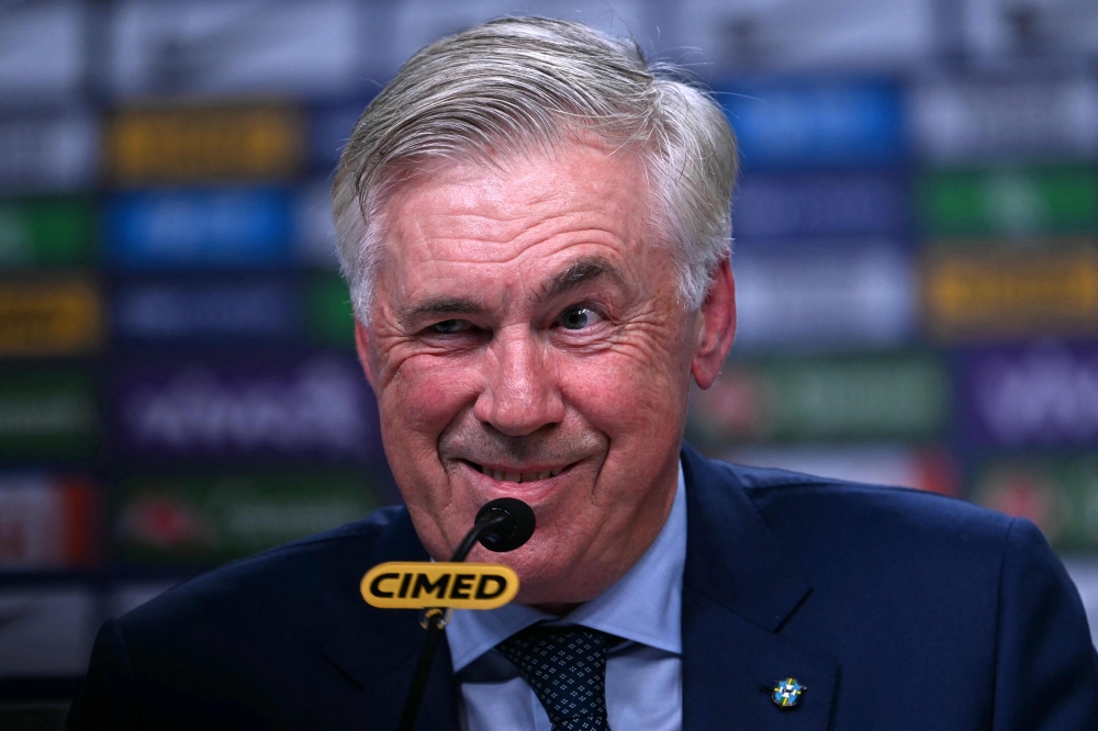 Brazil's football team head coach, Italian Carlo Ancelotti, gestures during a press conference at the Brazilian Football Confederation (CBF) headquarters in Barra da Tijuca neighbourhood, Rio de Janeiro, Brazil, on August 25, 2025. (Photo by Mauro Pimentel / AFP)