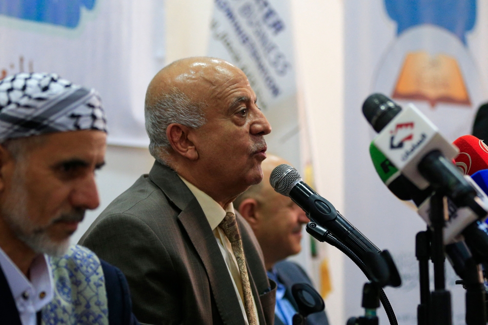Yemen's Houthi-led government's Prime Minister Ahmed Al-Rahawi speaks during a press conference in Sanaa on June 22, 2025. (Photo by Mohammed Huwais / AFP)