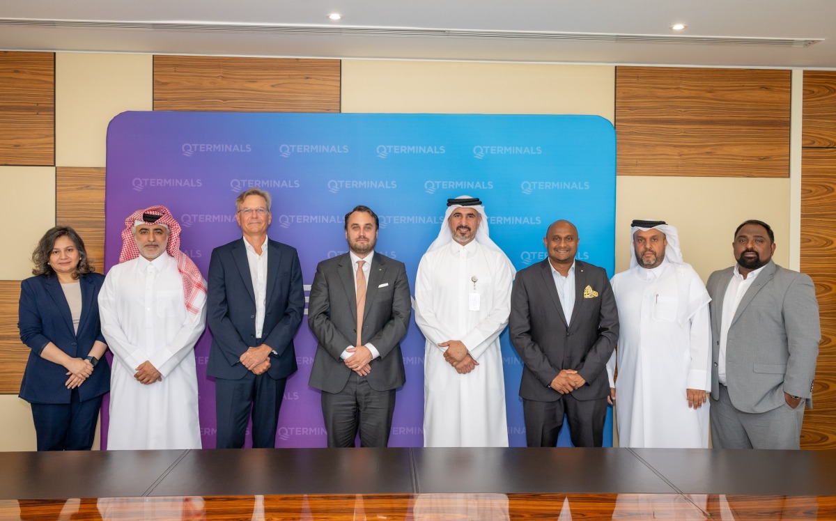 QTerminals and GAC officials pose for a group photo during the agreement signing.