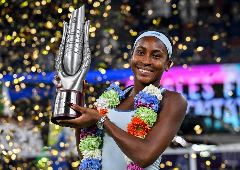 USA's Coco Gauff poses with her trophy after winning against USA's Jessica Pegula during an award ceremony for their women's singles at the Wuhan Open tennis tournament in Wuhan, Central China's Hubei province on October 12, 2025. (Photo by Adek Berry / AFP)