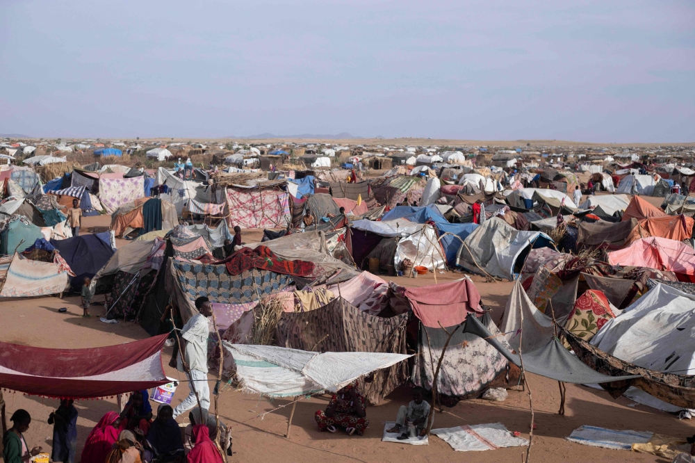 Makeshift shelters erected by displaced Sudanese who fled El-Fasher after the city fell to the Rapid Support Forces (RSF), make up the Um Yanqur camp, located on the southwestern edge of Tawila, in war-torn Sudan's western Darfur region on November 3, 2025. (Photo by AFP)