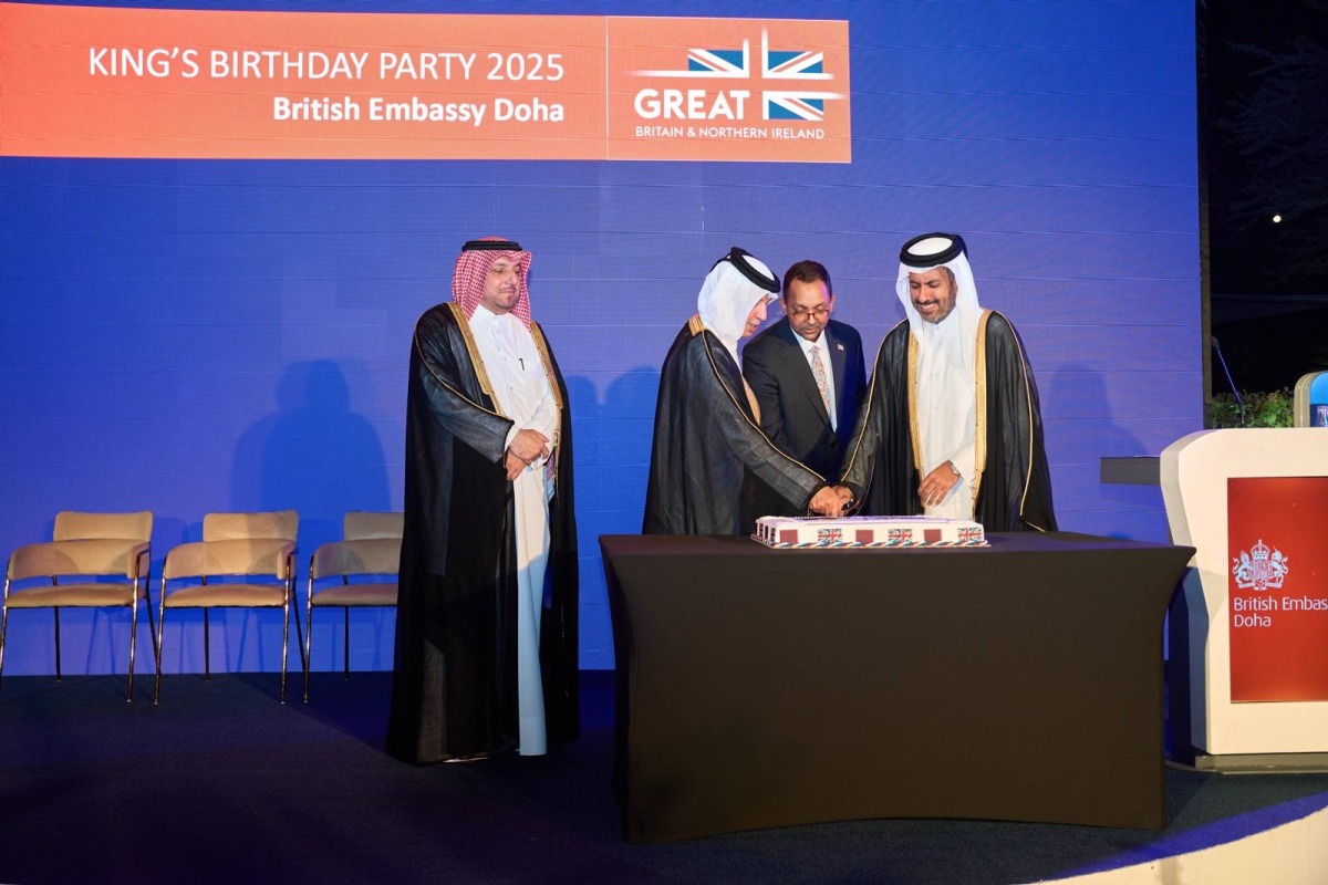 Minister of Commerce and Industry, H E Sheikh Faisal bin Thani bin Faisal Al-Thani; Minister of State for Foreign Affairs, H E Sultan bin Saad Al Muraikhi; Director of the Protocol Department at MoFA, H E Ibrahim Yousif Abdullah Fakhro; and Ambassador of the UK to Qatar, H E Neerav Patel cut the cake to celebrate the King's birthday. 