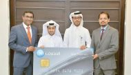 Top executives of QIB and Visa at the launch event.