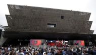 People stand during the dedication of the National Museum of African American History and Culture in Washington, U.S., September 24, 2016. Reuters/Joshua Roberts