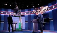 Workers make adjustments to the set for the first U.S. presidential debate at Hofstra University on September 25, 2016 in Hempstead, New York. Democratic presidential candidate Hillary Clinton is scheduled to debate Republican presidential candidate Donal