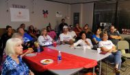 Supporters of Republican presidential nominee Donald Trump watch the first presidential debate between Republican nominee Donald Trump and Democratic presidential nominee Hillary Clinton at the Colorado Republican Party's Adams County Victory Office in Th