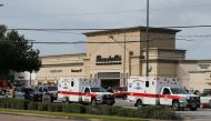 Ambulance crews on standby after a gunman went on a shooting rampage wounding nine before he was shot and killed by police on September 26, 2016 in Houston, Texas. Bob Levey/Getty Images/AFP