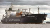 A bagpiper plays from the prow of the JS Ineon Insight ship carrying the first shipment of shale gas from the United States as it arrives to dock at Grangemouth in Scotland yesterday. 