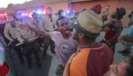 Protesters face off with police, as others try to block them during a rally in El Cajon, a suburb of San Diego, California on September 28, 2016, in response to the police shooting the night before. (AFP / Bill Wechter)