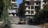 Syrian pro-government forces take control of Aleppo's Suleiman al-Halabi neighbourhood, which is divided by the frontline that separates the rebel-held east and regime-held west of the northern city, on September 30, 2016. AFP / GEORGES OURFALIAN