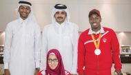 Qatar Olympic Committee President Sheikh Joaan bin Hamad Al Thani poses for a photograph with Rio 2016 Olympic silver medallist Mutaz Essa Barshim (left) and Paralympic silver medallists Abdelrahman Abdelqader (right) and Sara Masoud at the QOC headquarte