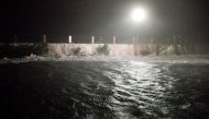 Storm surge pours over the sea wall onto a flooded section of East Battery Street at the southern-most tip of the city as Hurricane Matthew arrives in Charleston, South Carolina late October 7, 2016. REUTERS/Jonathan Drake