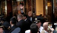Republican presidential nominee Donald Trump waves to supporters outside the front door of Trump Tower where he lives in the Manhattan borough of New York, U.S., October 8, 2016. REUTERS/Mike Segar
