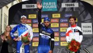 (From L to R) Second-placed French's cyclist Arnaud Demare of teaml FDJ, race winner Colombian cyclist Fernando Gaviri of team Etixx-Quick Step and third-placed Belgium's cyclist Jonas Van Genechten of team IAM CYCLING celebrate on the podium of the singl