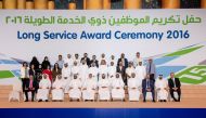 RasGas’ Chief Executive Officer, Hamad Mubarak Al Muhannadi with the long-serving employees