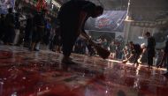 Afghan Shiite Muslims use chains and blades during ritual self-flagellation as part of Ashura commemorations at a mosque in Kabul on October 9, 2016. AFP / SHAH MARAI