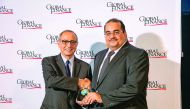 Yousuf Ali Darwish (right), General Manager, Group Communications, QNB, receiving the award. 