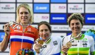 Amber Neben (centre)of the US, silver medallist Ellen van Dijk (left) of the Netherlands and bronze medallist Katrin Garfoot of Australia pose on the podium at the end of the women’s elite individual time trial event as part of the 2016 UCI Road World Cha
