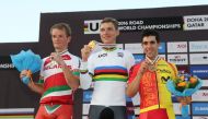 Germany's gold medallist Tony Martin (C), Belarus' silver medallist Vasil Kiryienka (L) and Spain's bronze medallist Jonathan Castroviejo celebrate on the podium at the end of the men's elite individual time trial event as part of the 2016 UCI Road World 