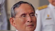 (FILES) This file photo taken on May 5, 2010 shows Thai King Bhumibol Adulyadej sitting on wheelchair after the ceremony marking the 60th anniversary of his coronation in Bangkok.  AFP / PORNCHAI KITTIWONGSAKUL