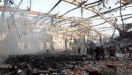 (FILES) This file photo taken on October 8, 2016 shows a general view of the destruction following reported airstrikes on a funeral hall by Saudi-led coalition air-planes on a building in the capital Sanaa./ AFP / MOHAMMED HUWAIS