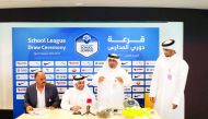 Officials of Qatar Football Association (QFA) conducting the draw ceremony of the School League in Doha yesterday. The school league is being held in collaboration with the Ministry of Education & Higher Education and Qatar School Sports Association (QSSA