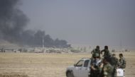 Smoke rises over Tarjala village as Peshmerga forces attack on Deash targets during an operation to liberate Mosul from Islamic State terrorist organization on October 17, 2016.  ( Hamit Hüseyin - Anadolu Agency )
