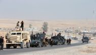 Iraqi security forces gather on the outskirt of Bartila, east of Mosul during an operation to attack Islamic State militants in Mosul, Iraq, October 19, 2016. REUTERS/Azad Lashkari