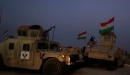 Kurdish Peshmerga fighters gather in front of Islamic State militants' position early morning outside the town of Naweran near Mosul, Iraq October 20, 2016. (REUTERS/Zohra Bensemra)