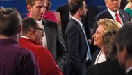 Hillary Clinton shakes hands with Ken Bone following the second presidential debate with Republican nominee Donald Trump at Washington University. (AFP)