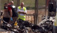 Investigators and rescue services at the scene of a plane crash at the airport in Valletta, Malta, 24 October 2016. REUTERS/Darrin Zammit Lupi
