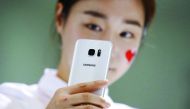 A model demonstrates a Samsung Electronics’ new smartphone Galaxy S7 during its launching ceremony in Seoul, South Korea. 
