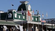 Media gather at the Dreamworld theme park on Gold Coast on October 25, 2016, after four people were killed when a park ride malfunctioned. Four people were killed at a theme park on Australia's popular Gold Coast on October 25, police said, with witnesses