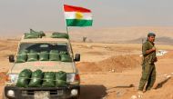 A Kurdish peshmerga fighter takes up a position as they clear Fadiliya village in Nawaran, north of Mosul, as part of their offensive to drive Islamic State from Mosul, Iraq, October 26, 2016. Picture taken October 26, 2016. REUTERS/Ahmed Jadallah
