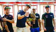 A rider holding pose for a photo with a falcon at the Falcon Centre at Souq Waqif. 