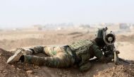 A Kurdish Peshmerga fighter looks through a Milan missile before recapturing from Islamic state militants the Fadiliya village in Nawaran, north of Mosul, Iraq, October 27, 2016. REUTERS/Air Jalal 