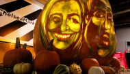 A giant pumpkin created by Master Carver Hugh McMahon with the faces of 2016 Democratic nominee Hillary Clinton and Republican presidential nominee Donald Trump is displayed at Chelsea Market in New York, U.S., October 28, 2016. REUTERS/Eduardo Munoz