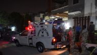 Pakistan Rangers stand guard after the firing incident in Karachi on October 29, 2016. Two gunmen on a motorcycle opened fire on a Shiite Muslim gathering in Pakistan's largest city of Karachi, killing five people, police and hospital officials said. (AFP