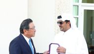 Emir H H Sheikh Tamim bin Hamad Al Thani presenting the outgoing Japan's Ambassador Shingo Tsuda with the Sash of Merit, at Emiri Diwan yesterday.