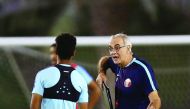 Qatar football players take part in a training session ahead of their friendly match against 2018 World Cup hosts Russia which will be played on Thursday in Doha. RIGHT: Head coach Jorge Fossati giving instructions to a player. The team will fly out to Ch