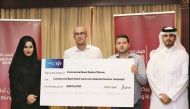 Commercial Bank officials with winners of the summer campaign.