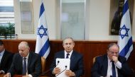 Israeli Prime Minister Benjamin Netanyahu (C) attends the weekly cabinet meeting at his office in Jerusalem, on November 13, 2016. (AFP / RONEN ZVULUN) 