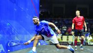 Mohamed Al Shorbagy of Egypt (left) in action against Nick Matthew of England during the Qatar Classic squash championship in Doha yesterday.Pic by : Abdul Basit/The Peninsula