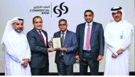 Officials of Commercial Bank receiving the ‘Best Cash Management Bank in Qatar’ award.