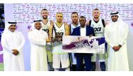 Qatar Basketball Federation (QBF) President Sheikh Saoud bin Abdulrahman Al Thani, (second left) presenting the winner's trophy to team Novi Sad Al Wahda of UAE during the FIBA 3x3 All Stars Basketball Tournament 2016 at Doha yesterday. Pics by: Kammutty 
